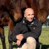 Man with two horses at Reigning Downs Hauora Centre in New Zealand.