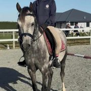 Young girl riding a horse at Reigning Downs Hauora Centre in New Zealand.