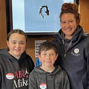 Smiling staff and children at Reigning Downs Hauora Centre in New Zealand.
