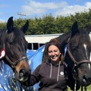 Woman with two horses at Reigning Downs Hauora Centre in New Zealand.