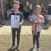 Children holding awards at Reigning Downs Hauora Centre event in NZ.