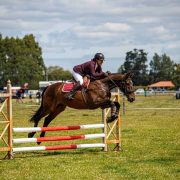 Equestrian jumping competition at Reigning Downs Hauora Centre in New Zealand.